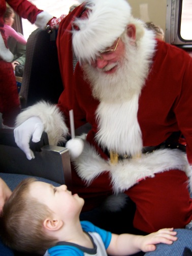 Stephen met Santa and made strange faces at him. Weird kid.